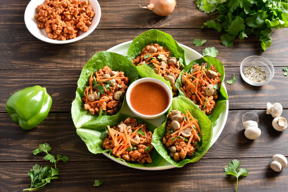 Asian,Minced,Meat,Lettuce,Wraps,On,Wooden,Background.